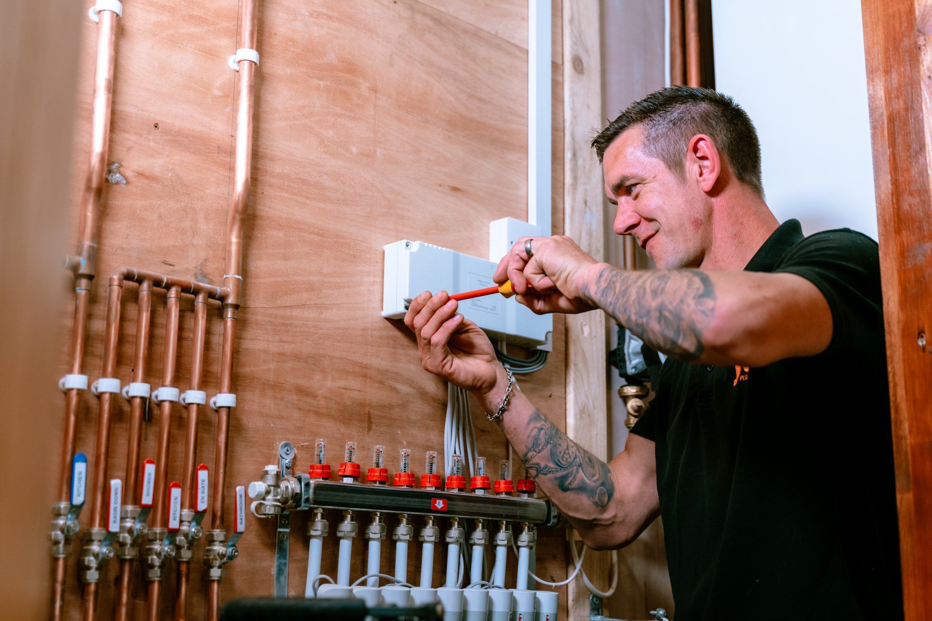 Jax Plumbing engineer fitting a manifold
