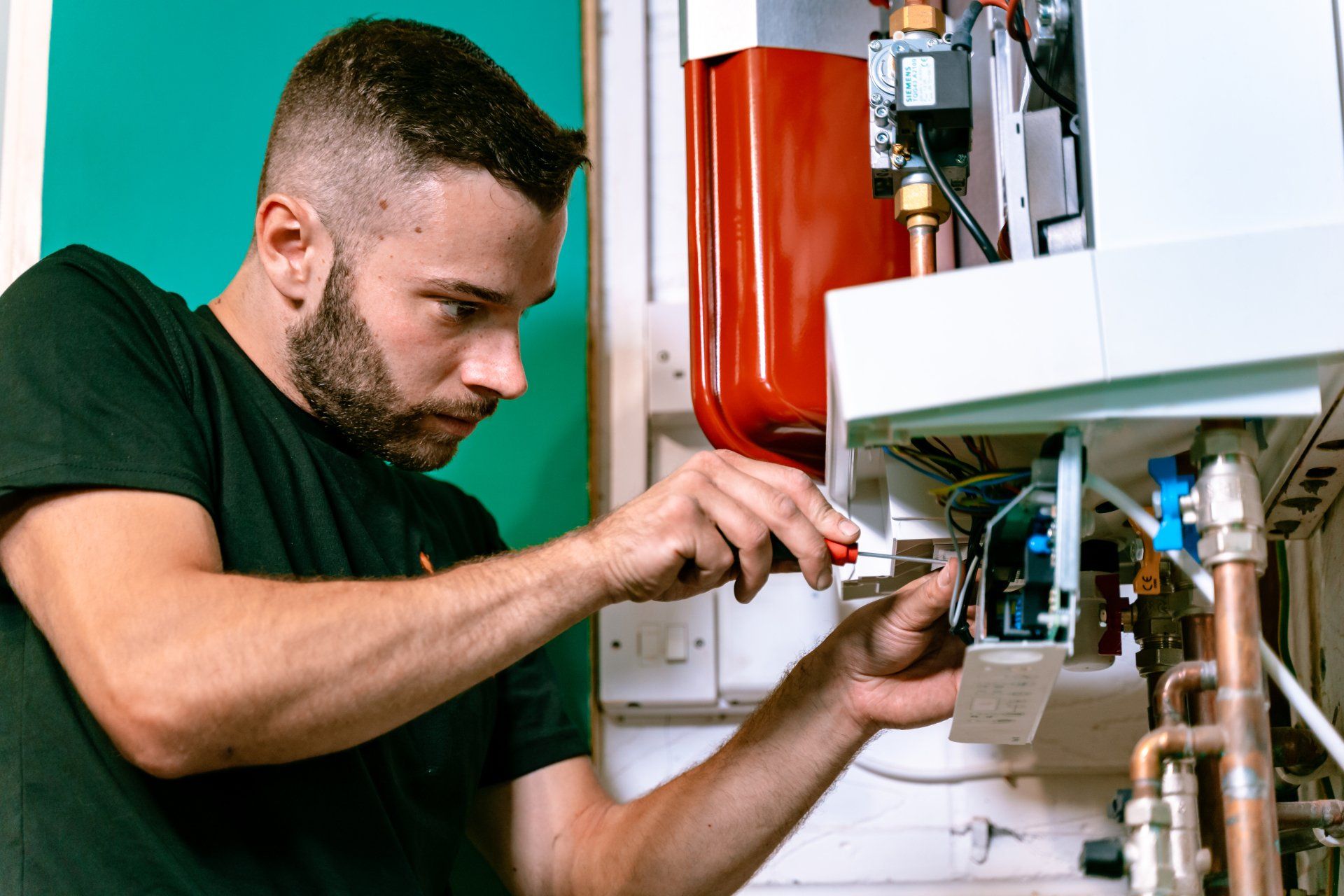 Jax Plumbing engineer installing a boiler